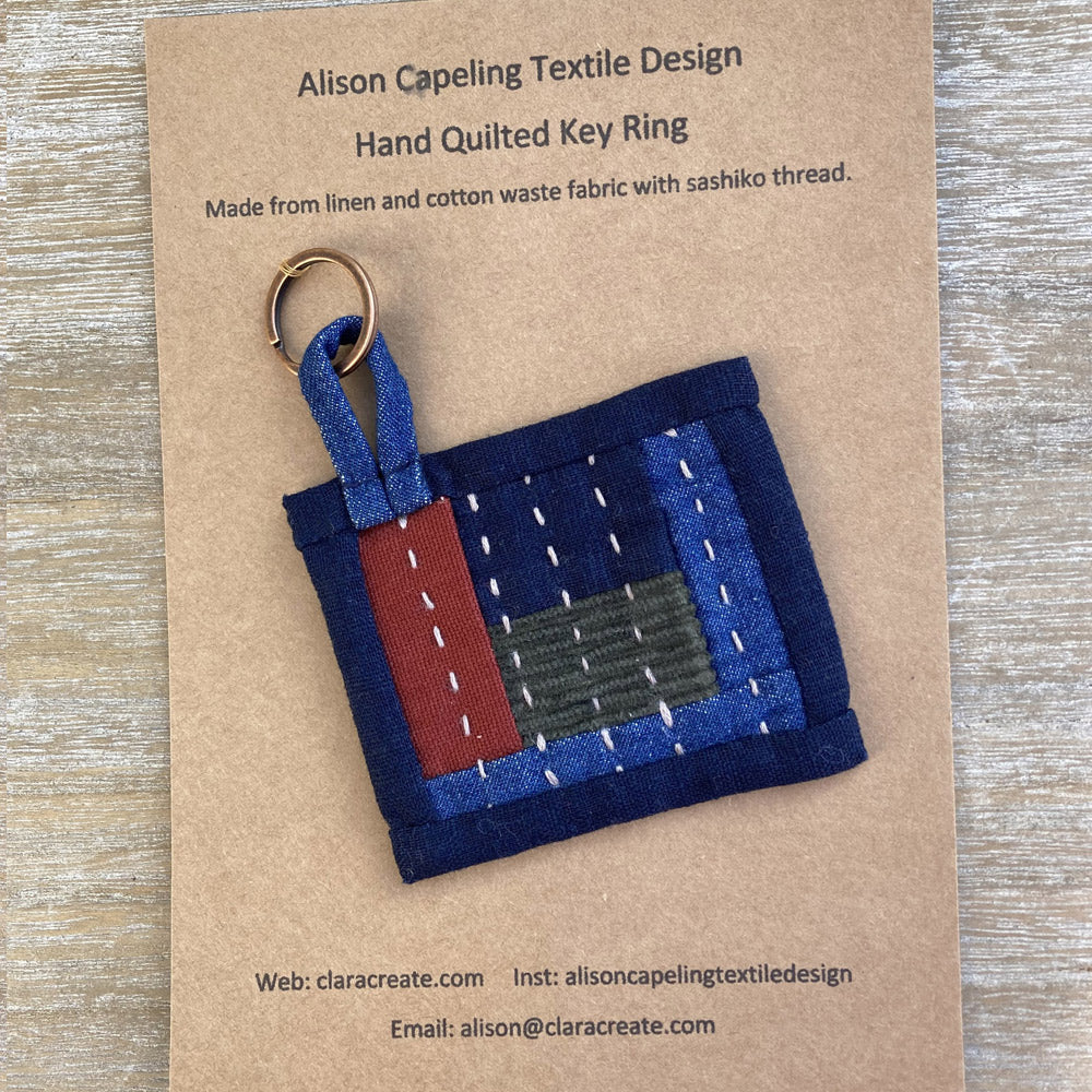 Hand quilted key fob, made from linen, cotton and denim. Finished in cotton sashiko thread.