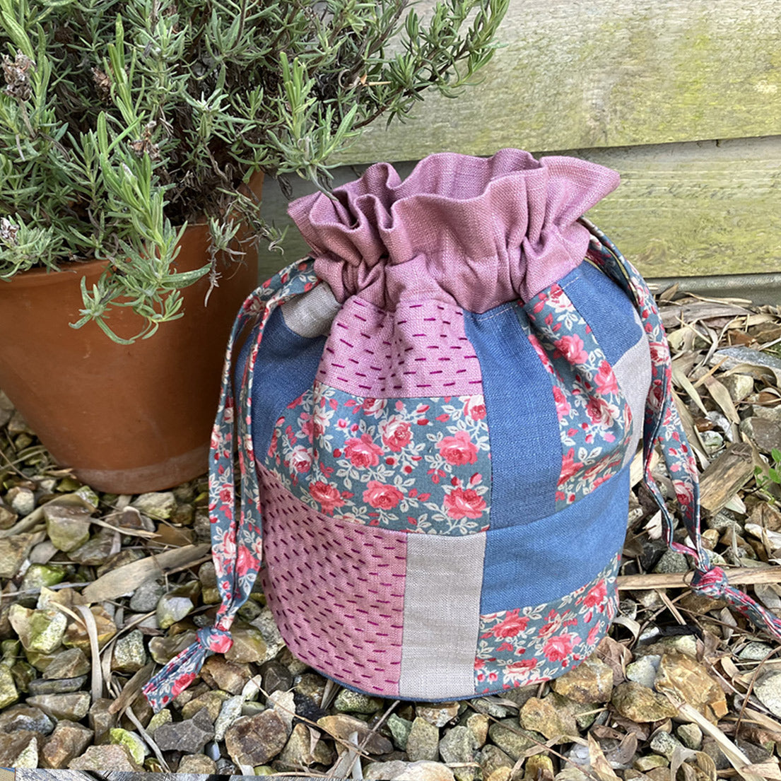 A pretty quilted drawstring bag, slow stitched by hand from natural linen and cotton fabric