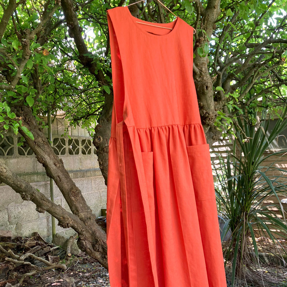 Womens pinafore apron in orange natural fabric