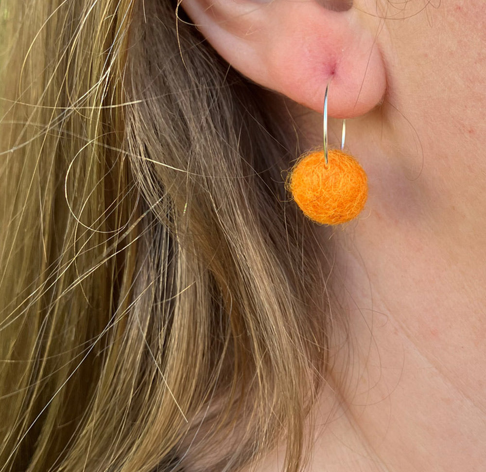 Handmade wool Pom Pom earrings with silver plated hoops