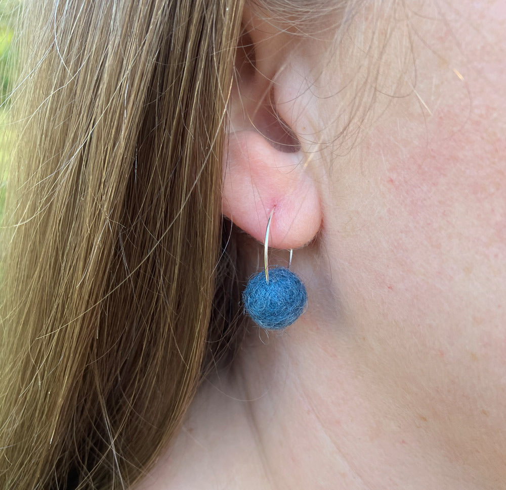 Blue, Felted Wool Pom Pom earrings with silver plated hoops.