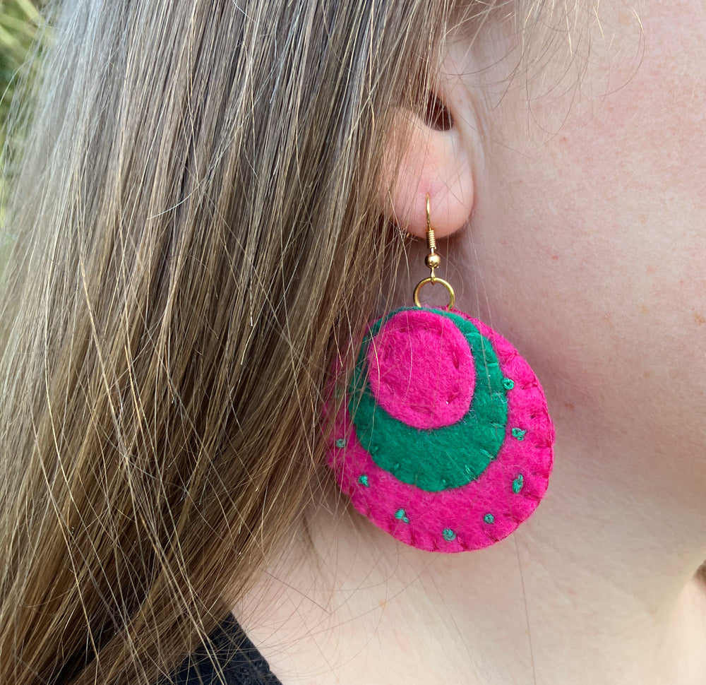 Handmade natural felt drop circle earrings in Pink and Emerald Green.