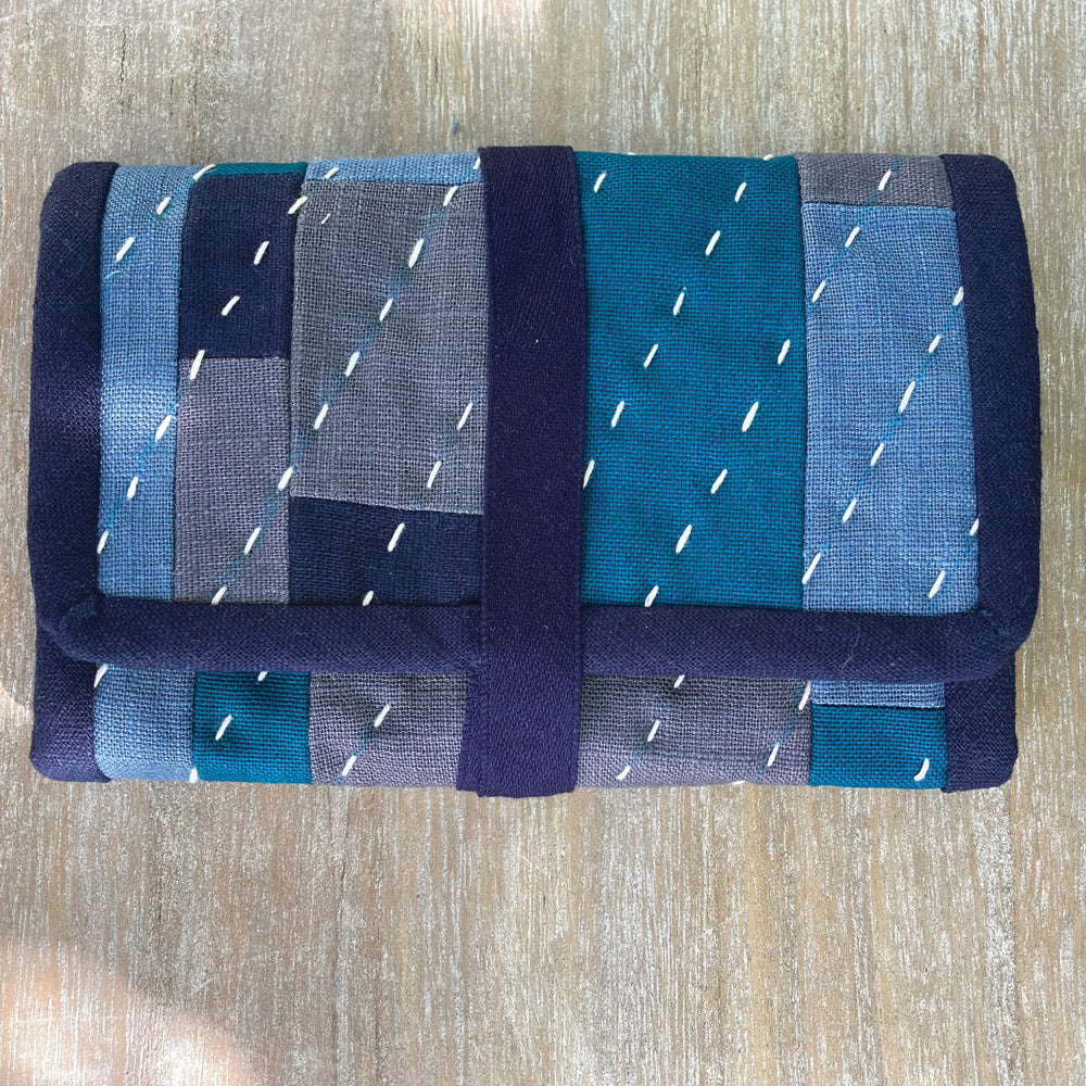 Hand stitched sewing accessory case.