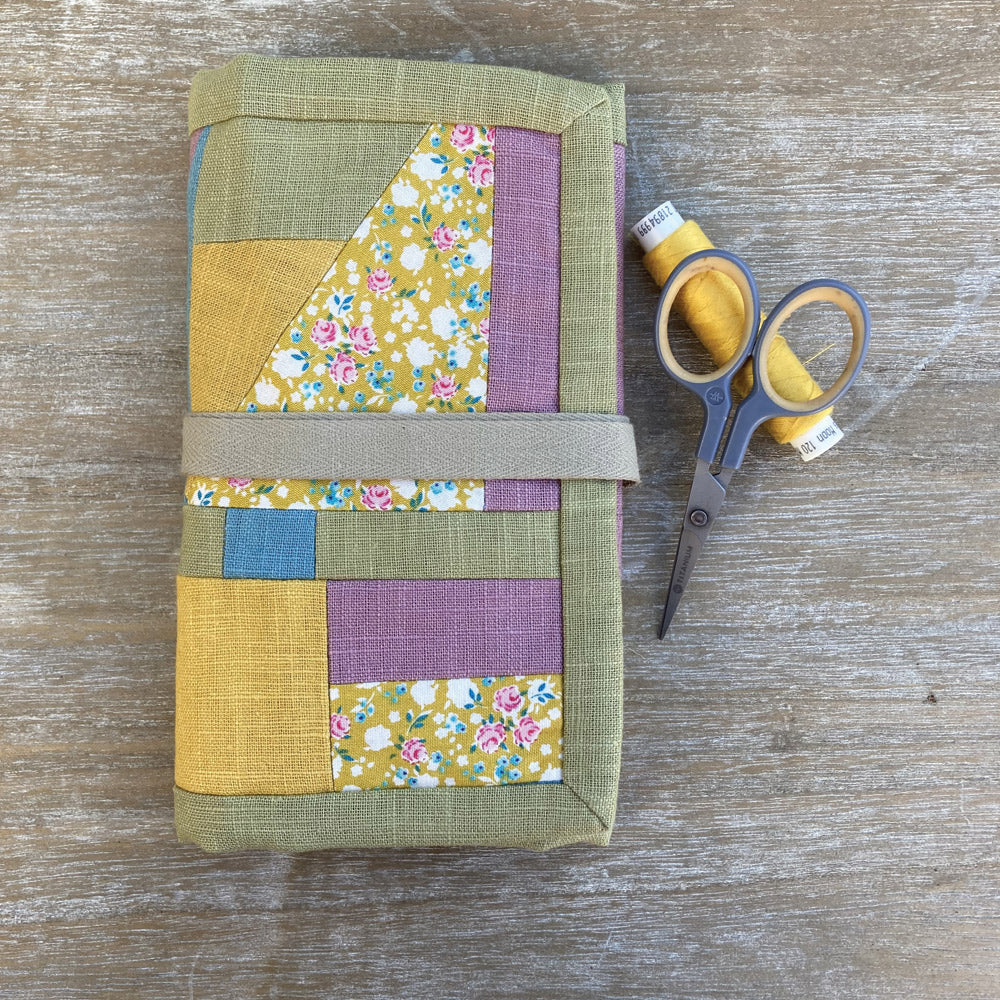 Roll up sewing case, individually made in green, pink and gold natural patchwork. For sewing accessories.