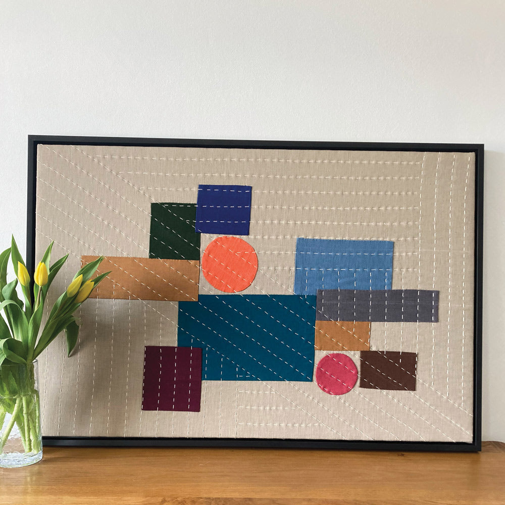 Large slow stitch picture. Handmade in linen and cotton and framed in black wood. Brightly coloured fabric.