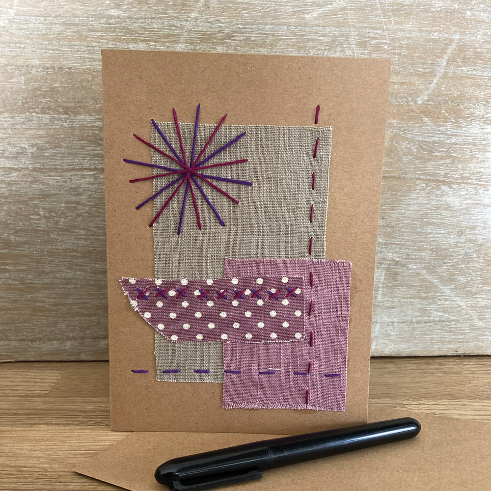 Handmade collage greetings card from hand sewn upcycled fabrics and thread.