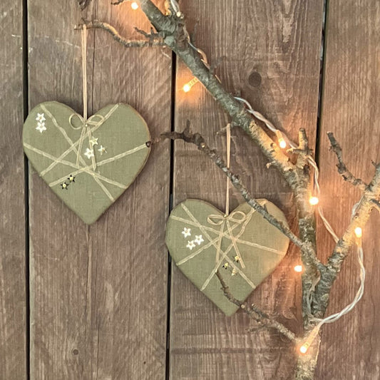 Pretty handmade hearts in a lovely olive green linen with gold ribbons, stars and beads.