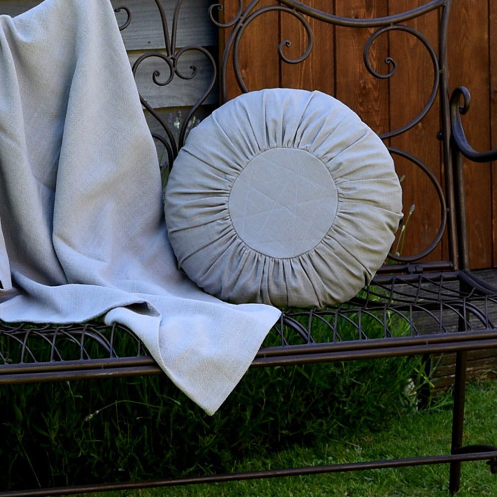 Round gathered Linen Cushion in Soft Grey.