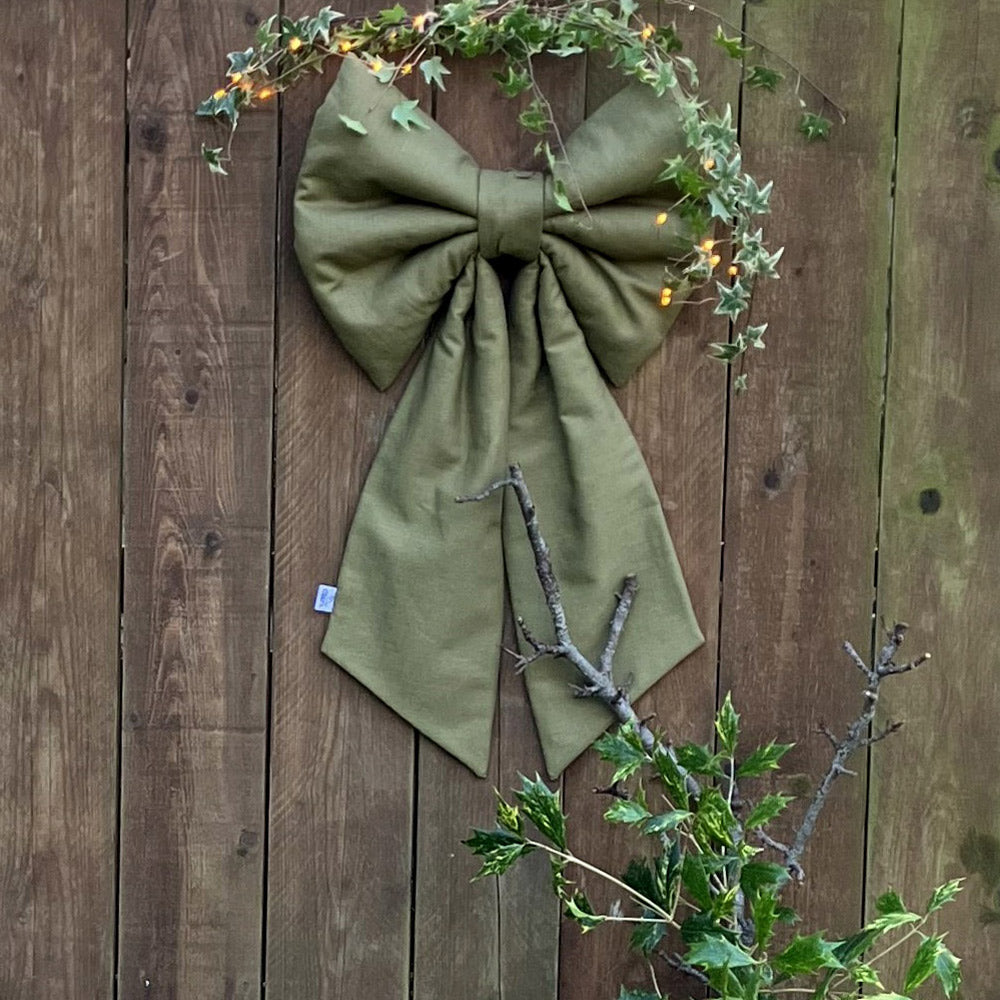 This sumptuous extra-large Christmas Bow in olive green natural fabric.
